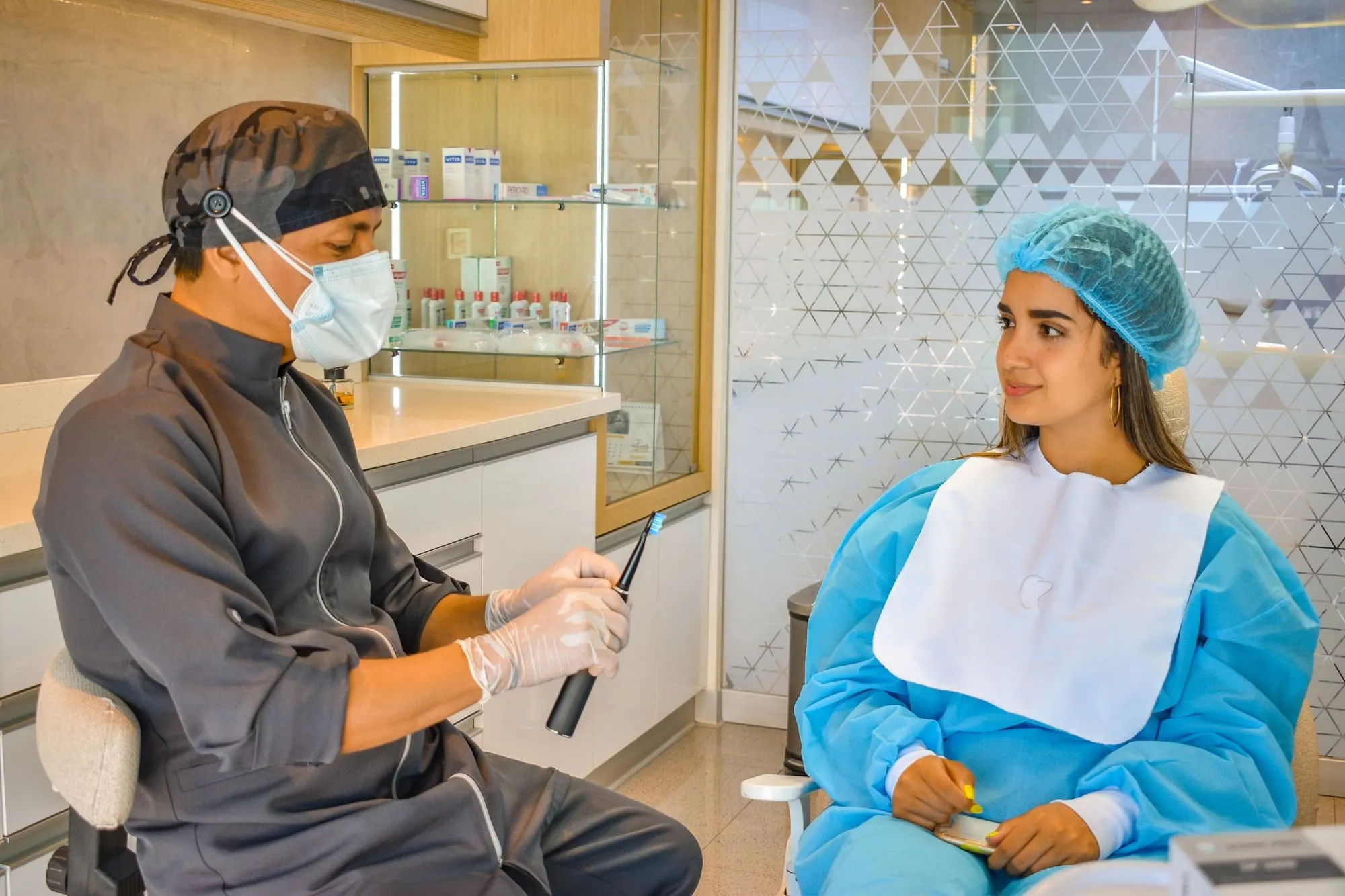 Dentist talking a patient through her treatment options