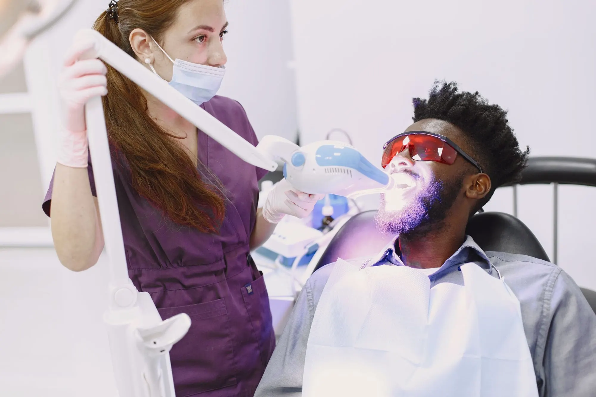 Patient having professional teeth whitening